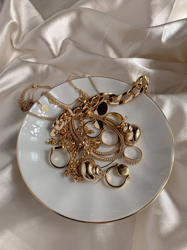 Scrap Gold jewelry laid out on a plate